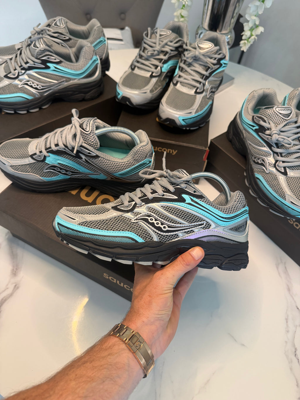 The Saucony ProGrid Omni 9 "Fossil / Splash" (Silver Teal Grey)
